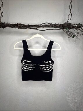 Out from under Black skull hands crop top